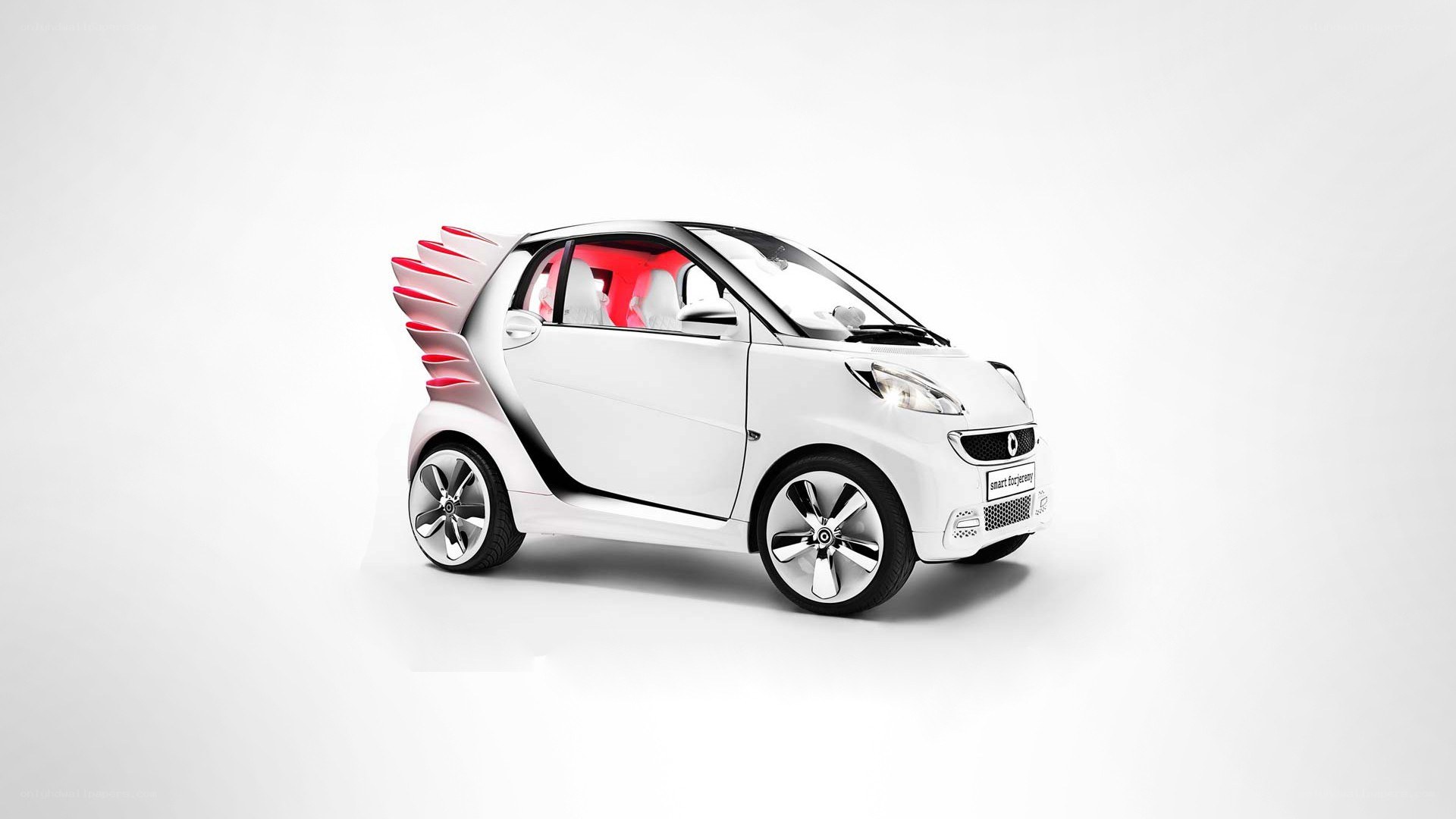 white smart car with red accents