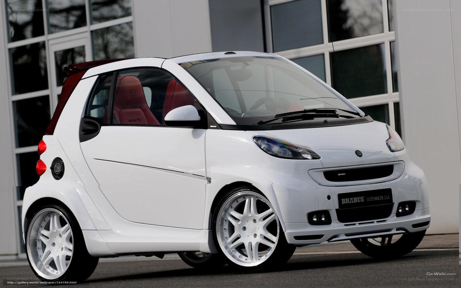 white smart car with red interior