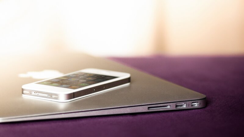 White Smartphone on Laptop — Silver