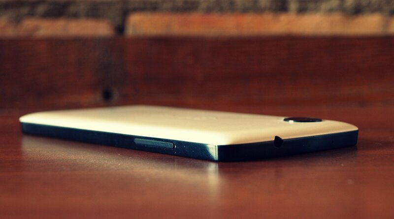 White Smartphone on Table — Brown