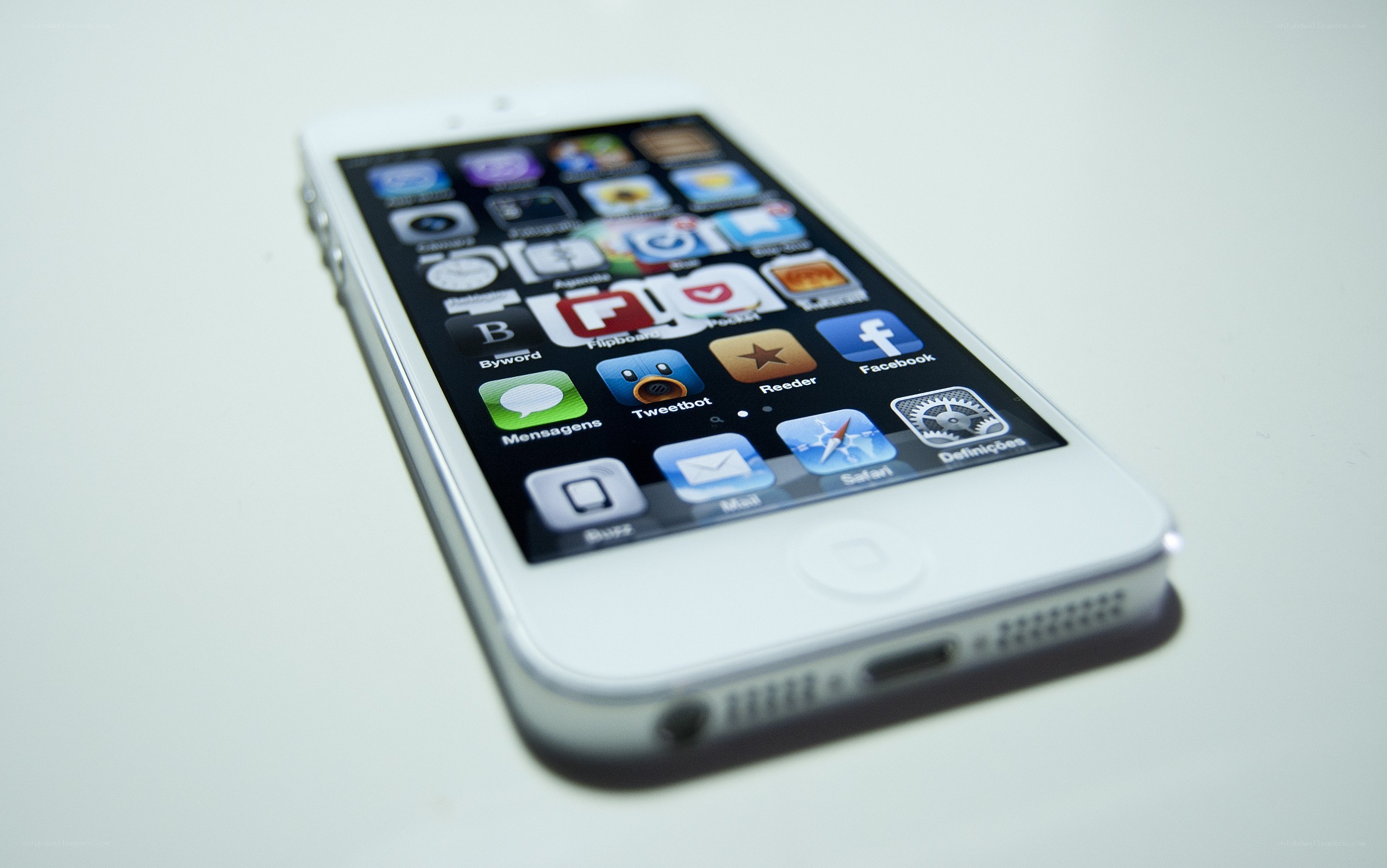 white smartphone on white surface