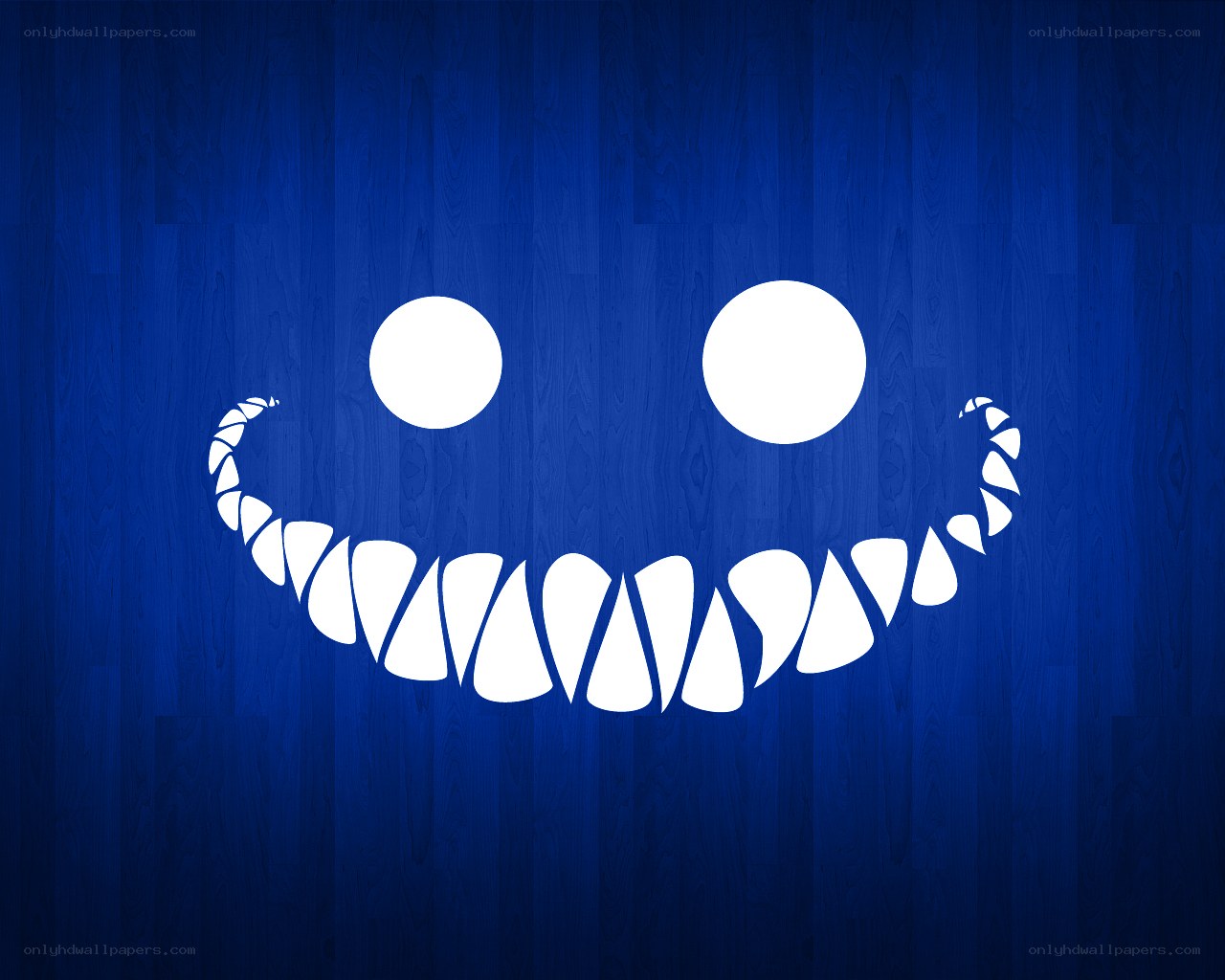 white smile on blue wood