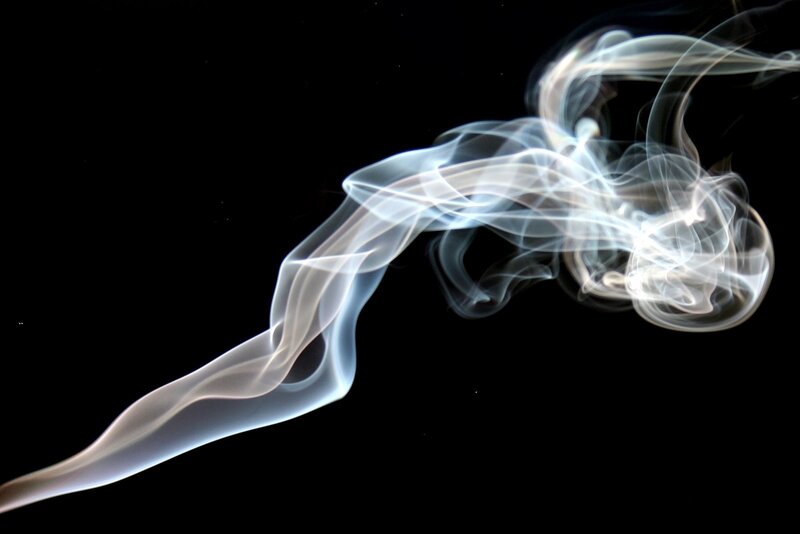 White smoke against black background
