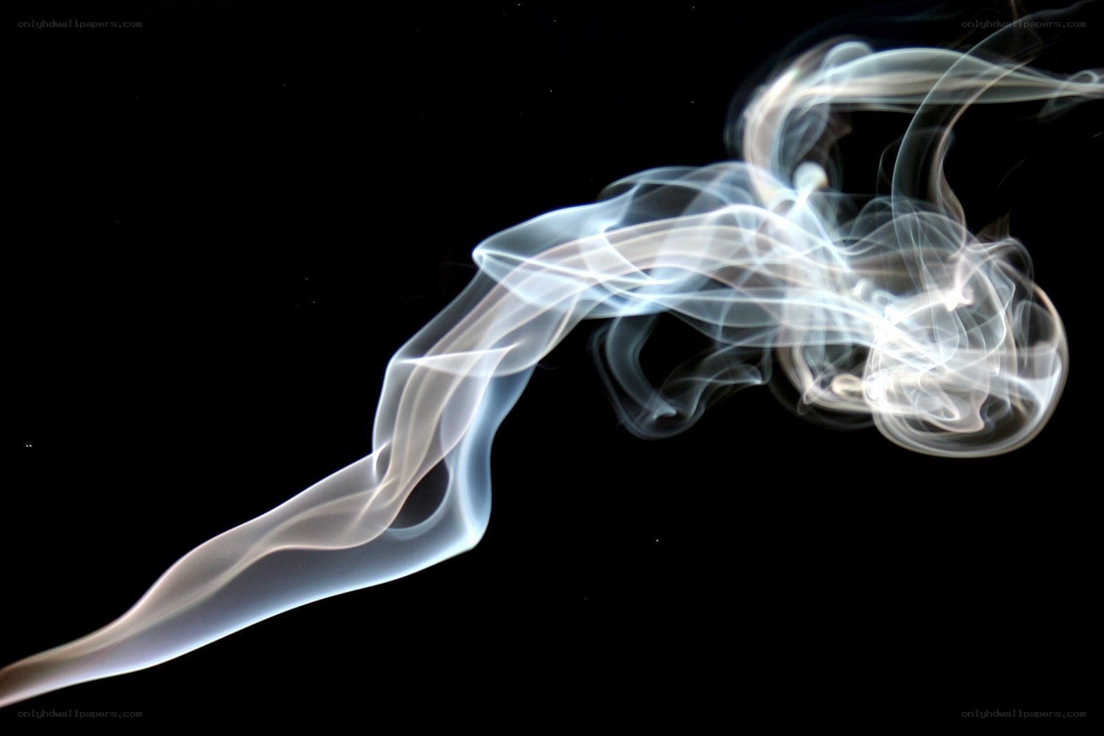 White smoke against black background