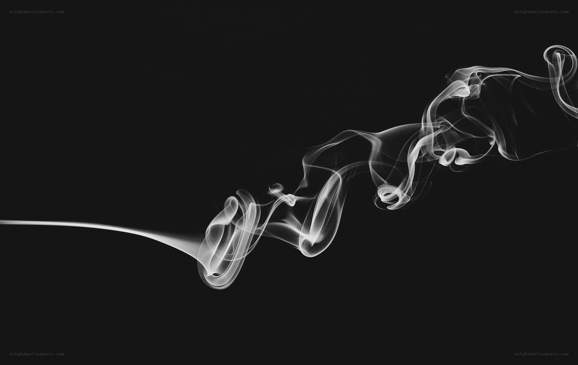 White smoke against black background