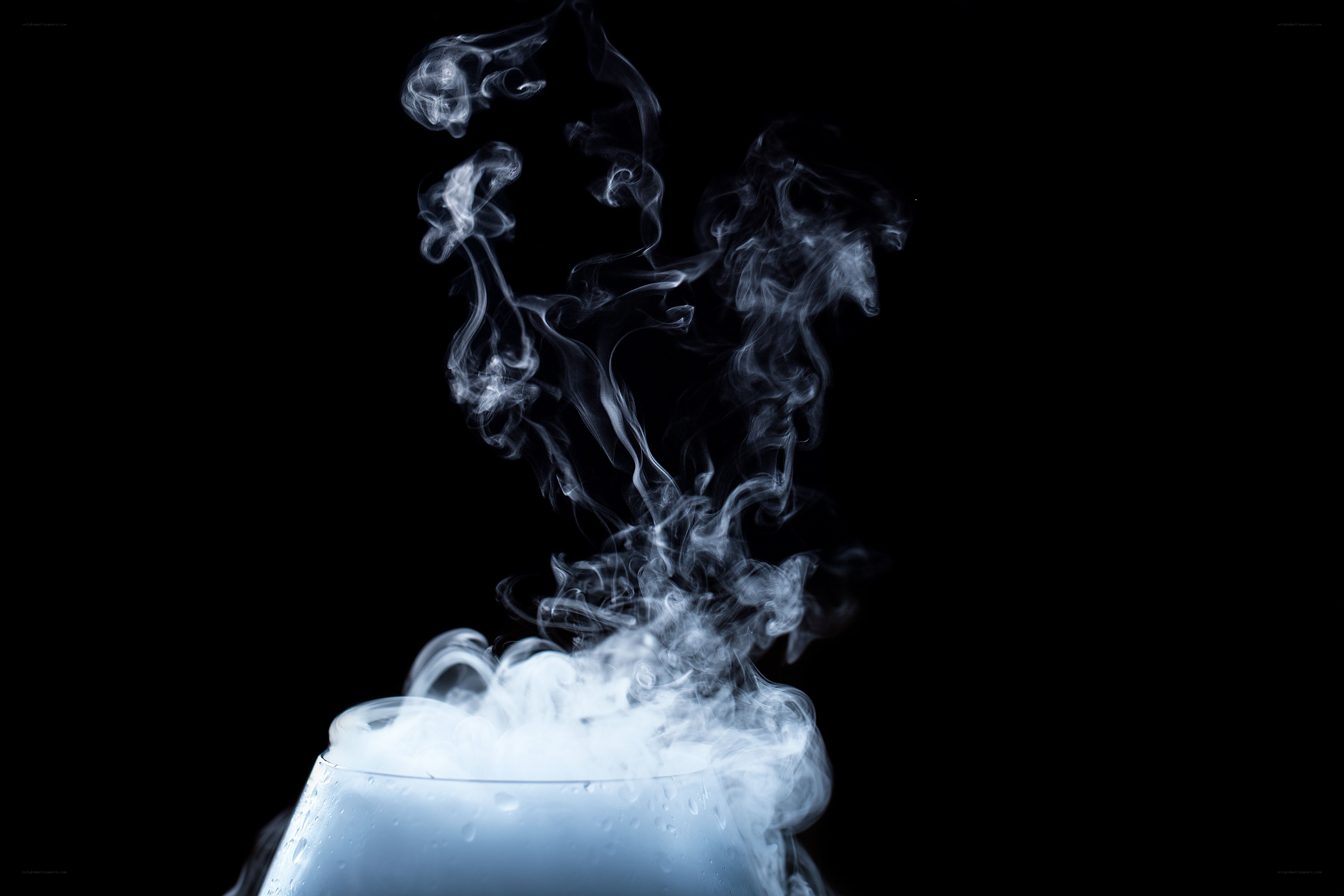 White smoke rising from glass