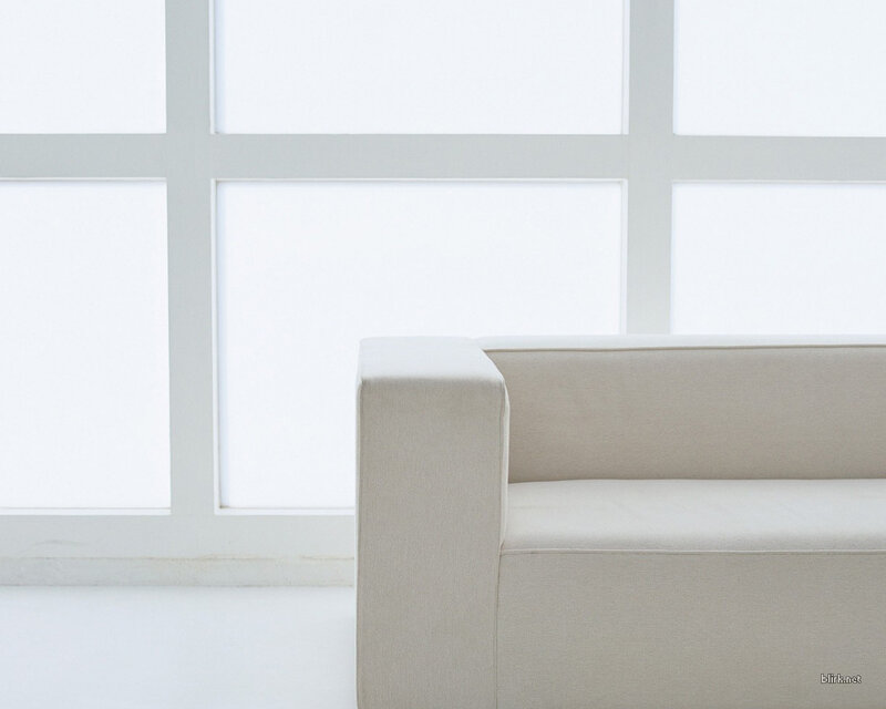 white sofa by window