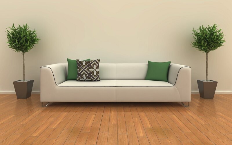 White sofa with green pillows