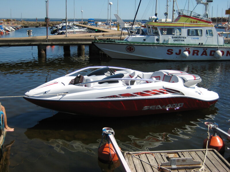 White Speedboat in Harbor