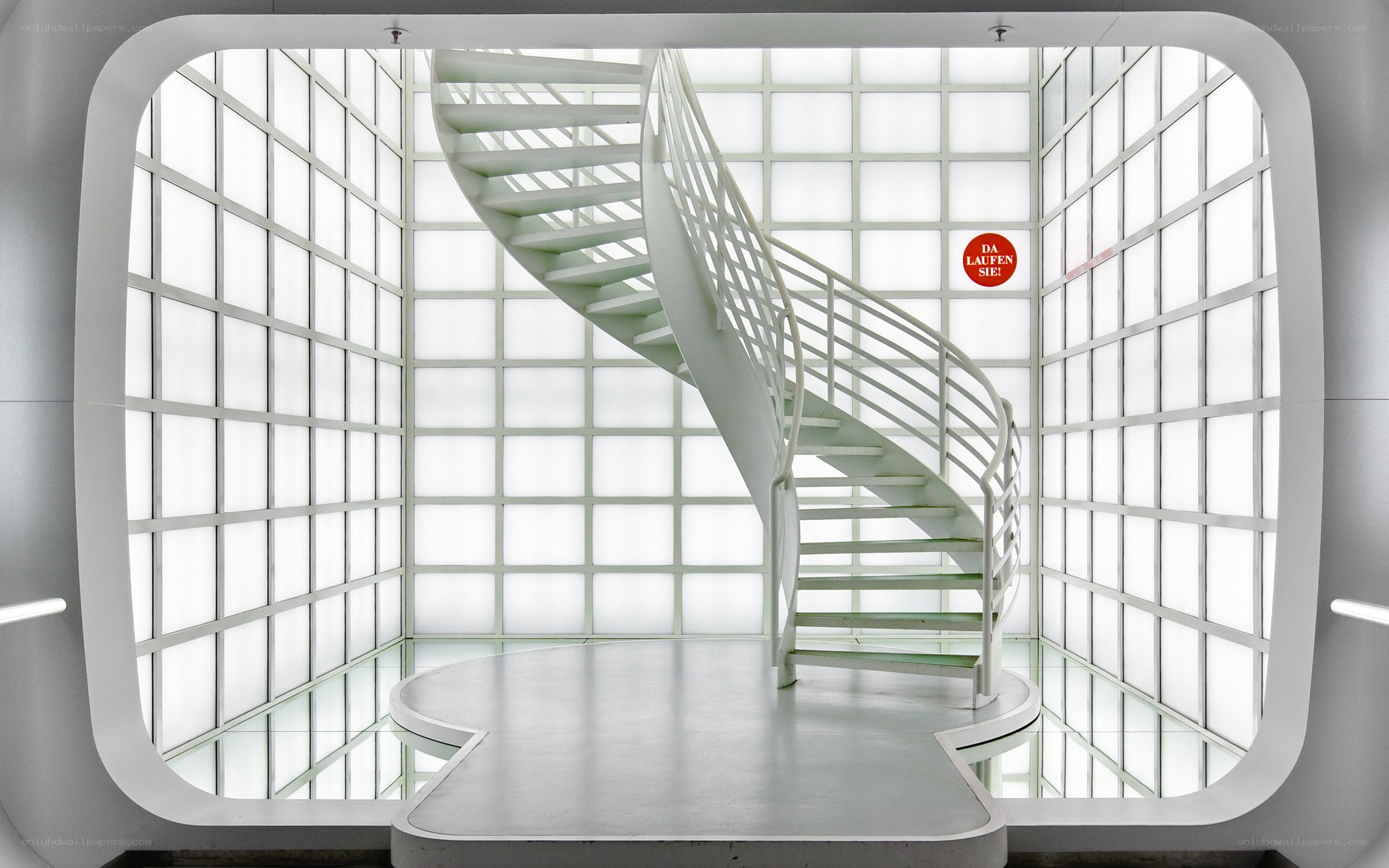 White spiral staircase in modern atrium