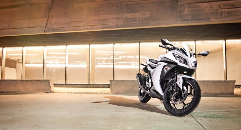 White Sport Motorcycle — Dramatic, Night, Photograph, Concrete Structure