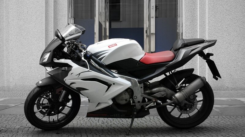 White Sport Motorcycle — Neutral, Photograph, Building
