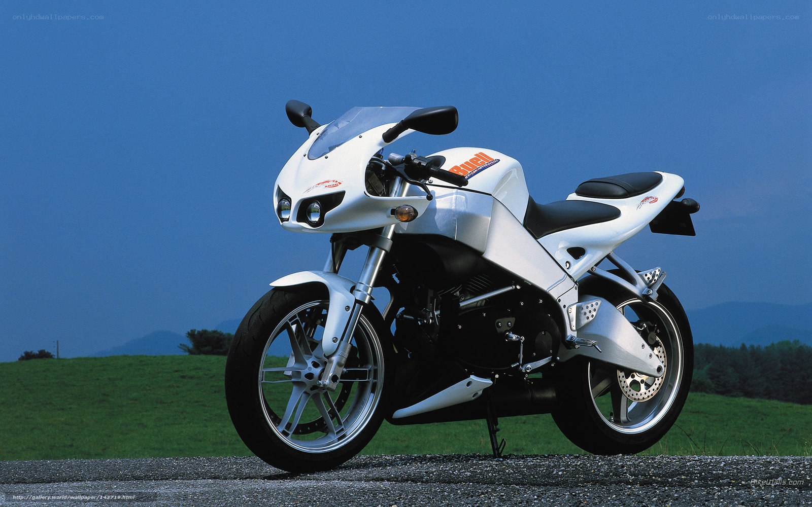 white sport motorcycle on road
