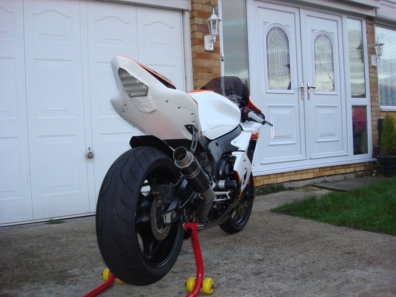 white sport motorcycle on stand