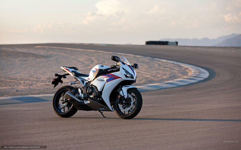 white sport motorcycle on track