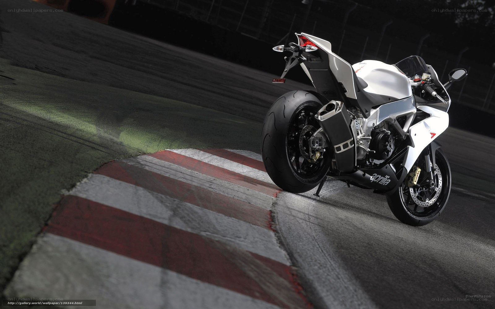 white sport motorcycle on track