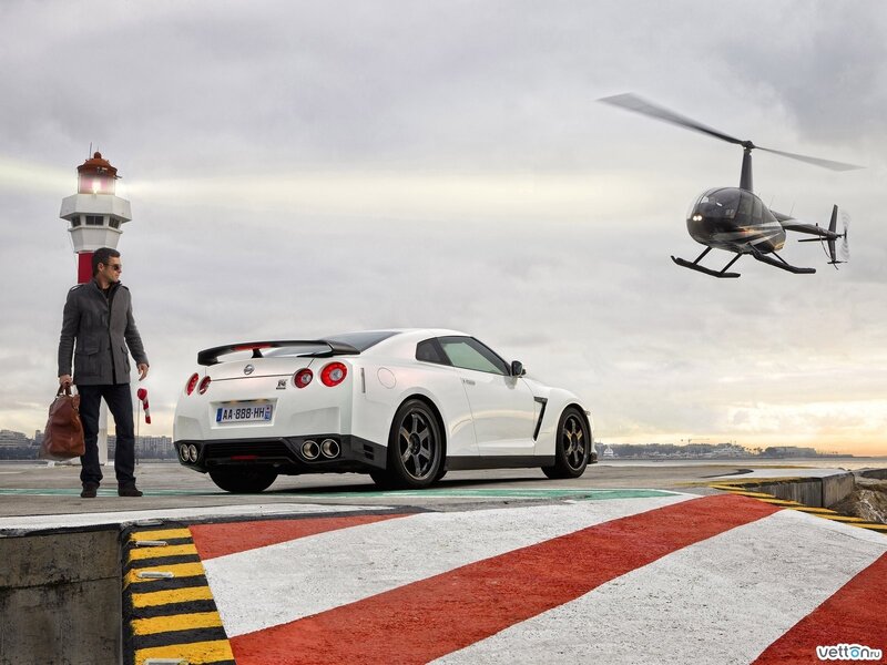 White sports car and helicopter