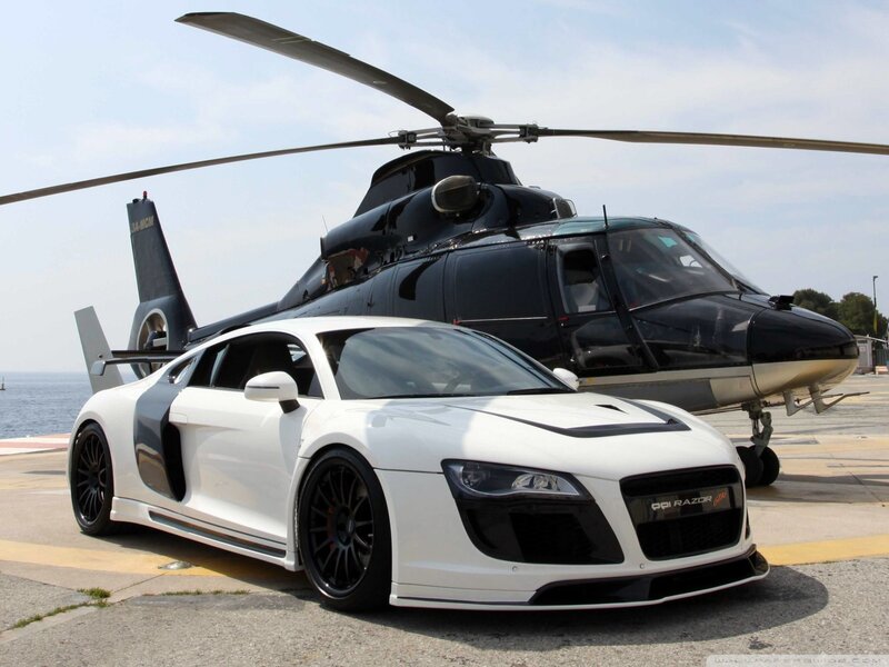 White sports car and helicopter