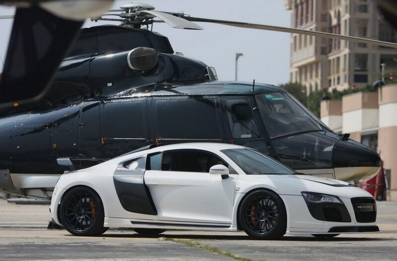 White sports car and helicopter