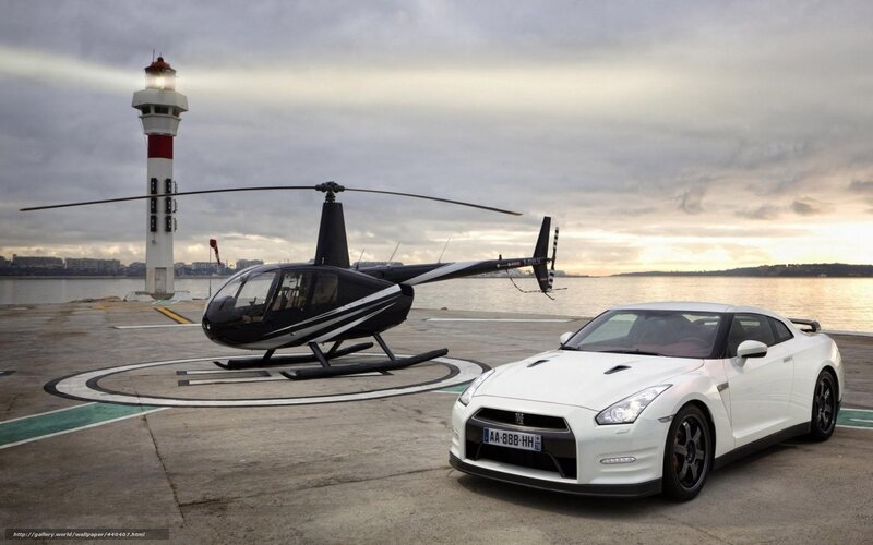 White sports car and helicopter at dock