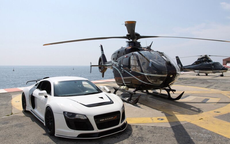 White sports car and helicopter