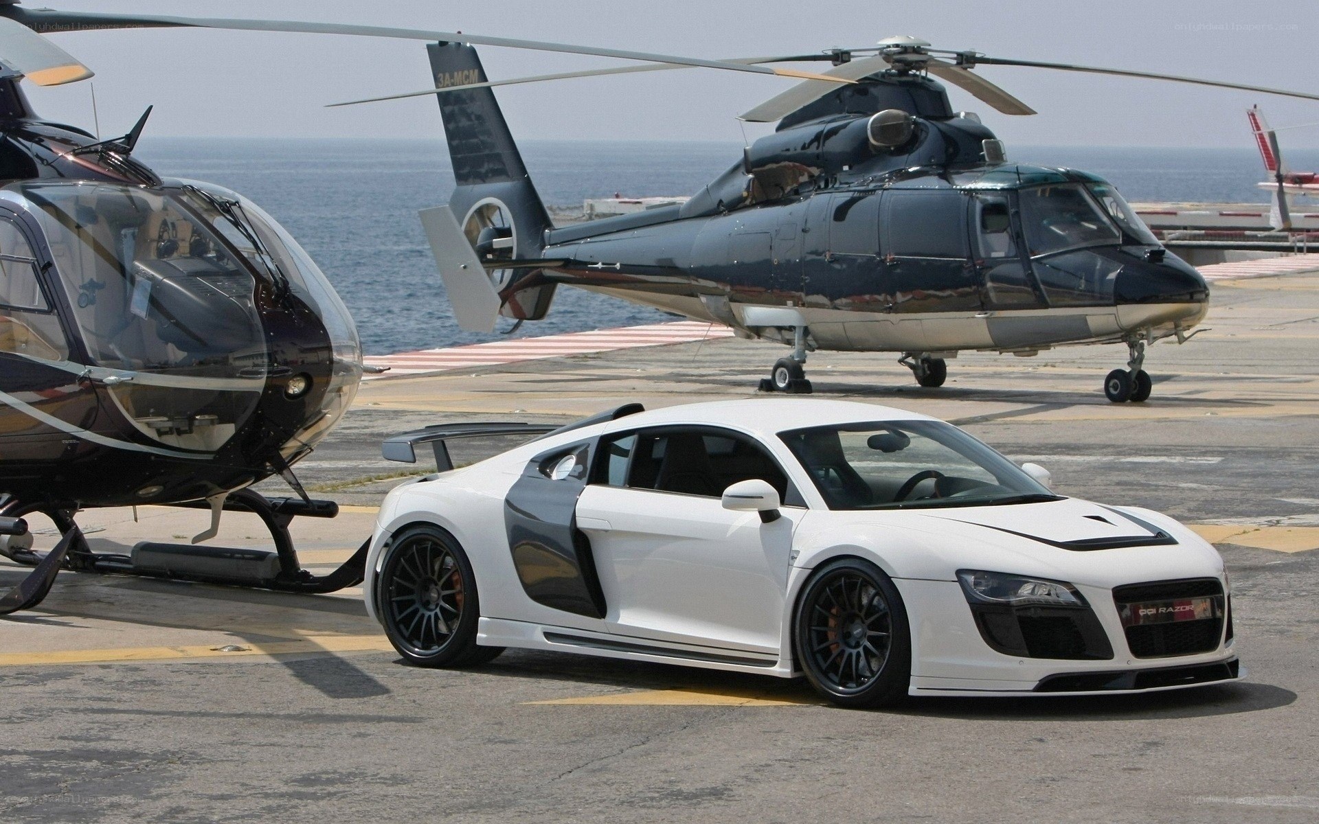 White sports car and helicopters