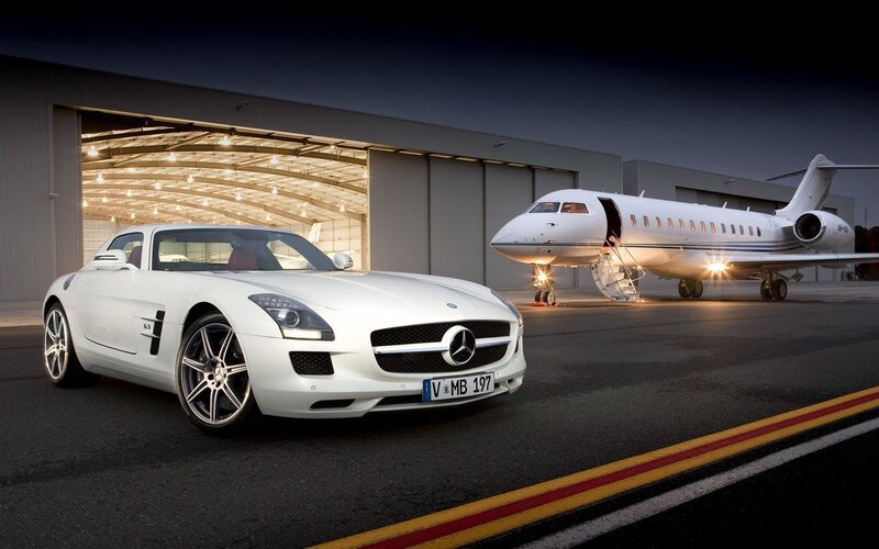 White sports car and private jet