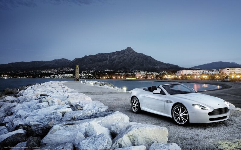 White sports car at coastal pier