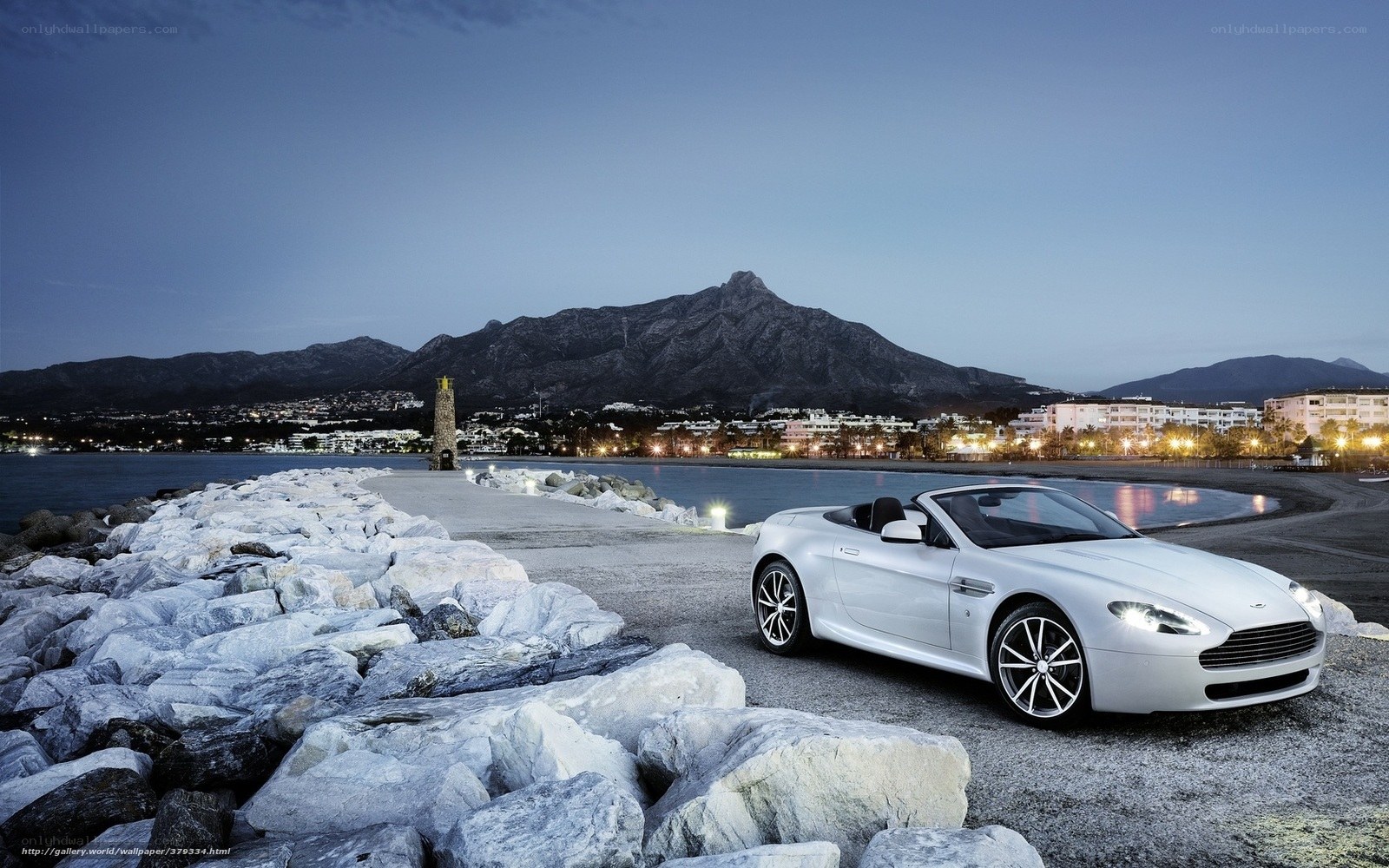 White sports car at coastal pier