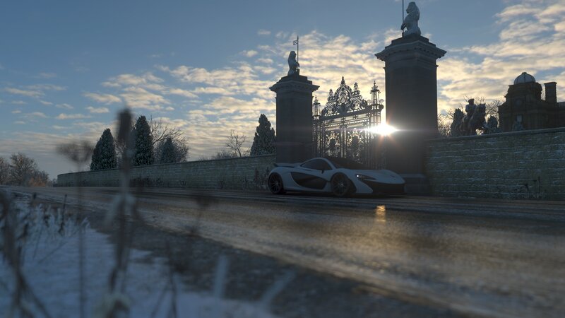 White Sports Car at Gate