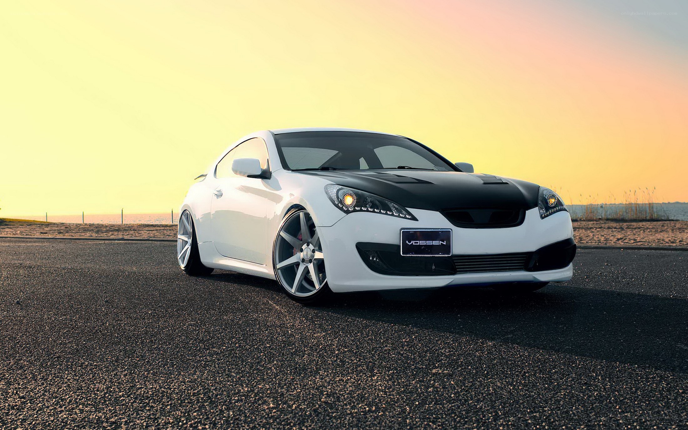 white sports car at sunset