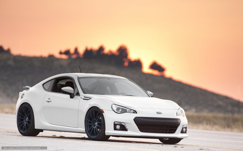 White sports car at sunset