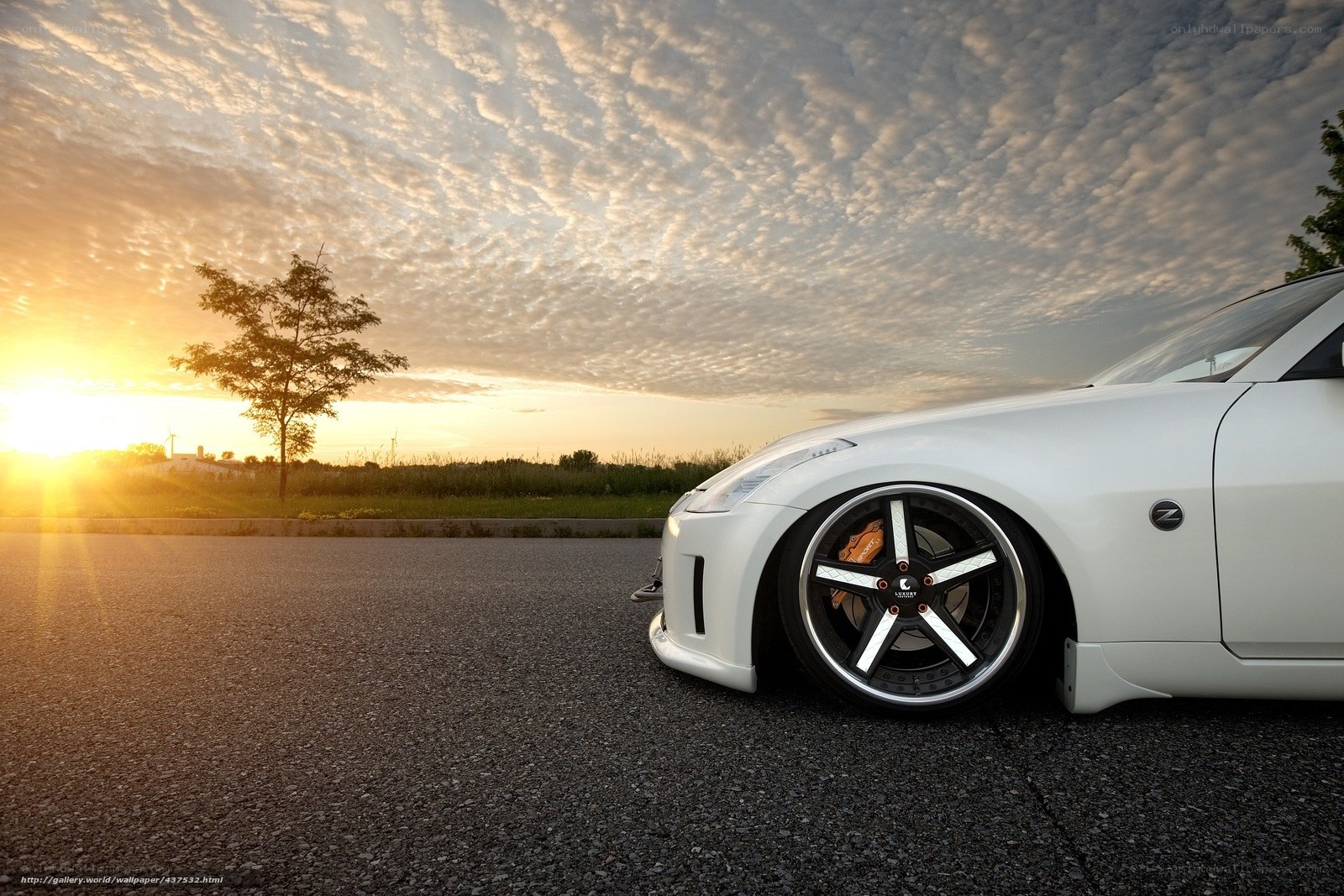 White sports car at sunset