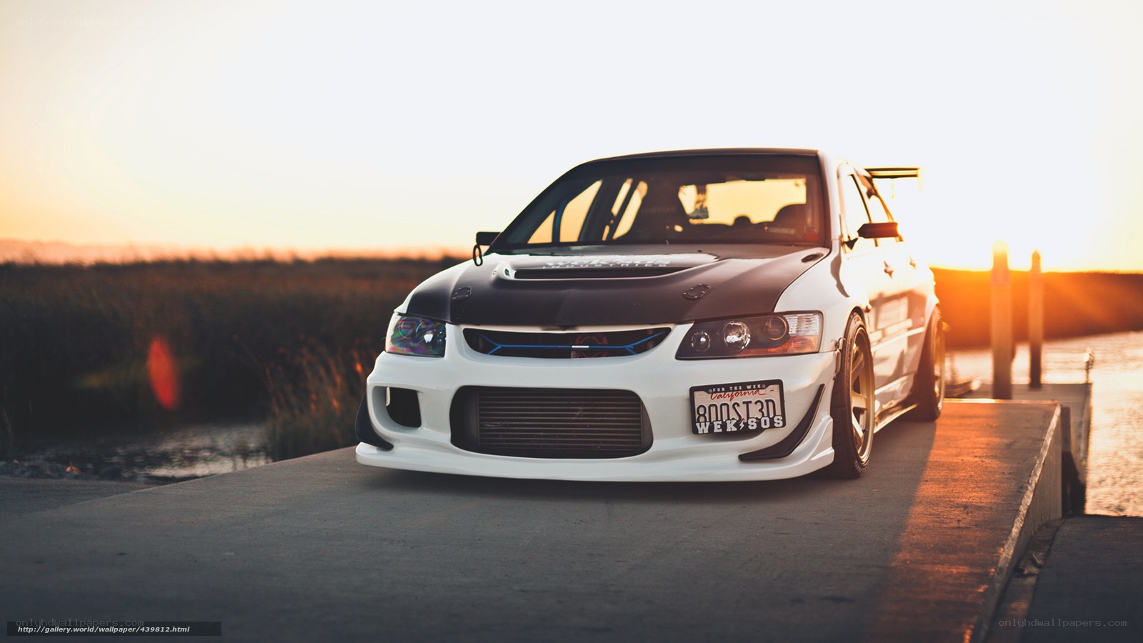 white sports car at sunset