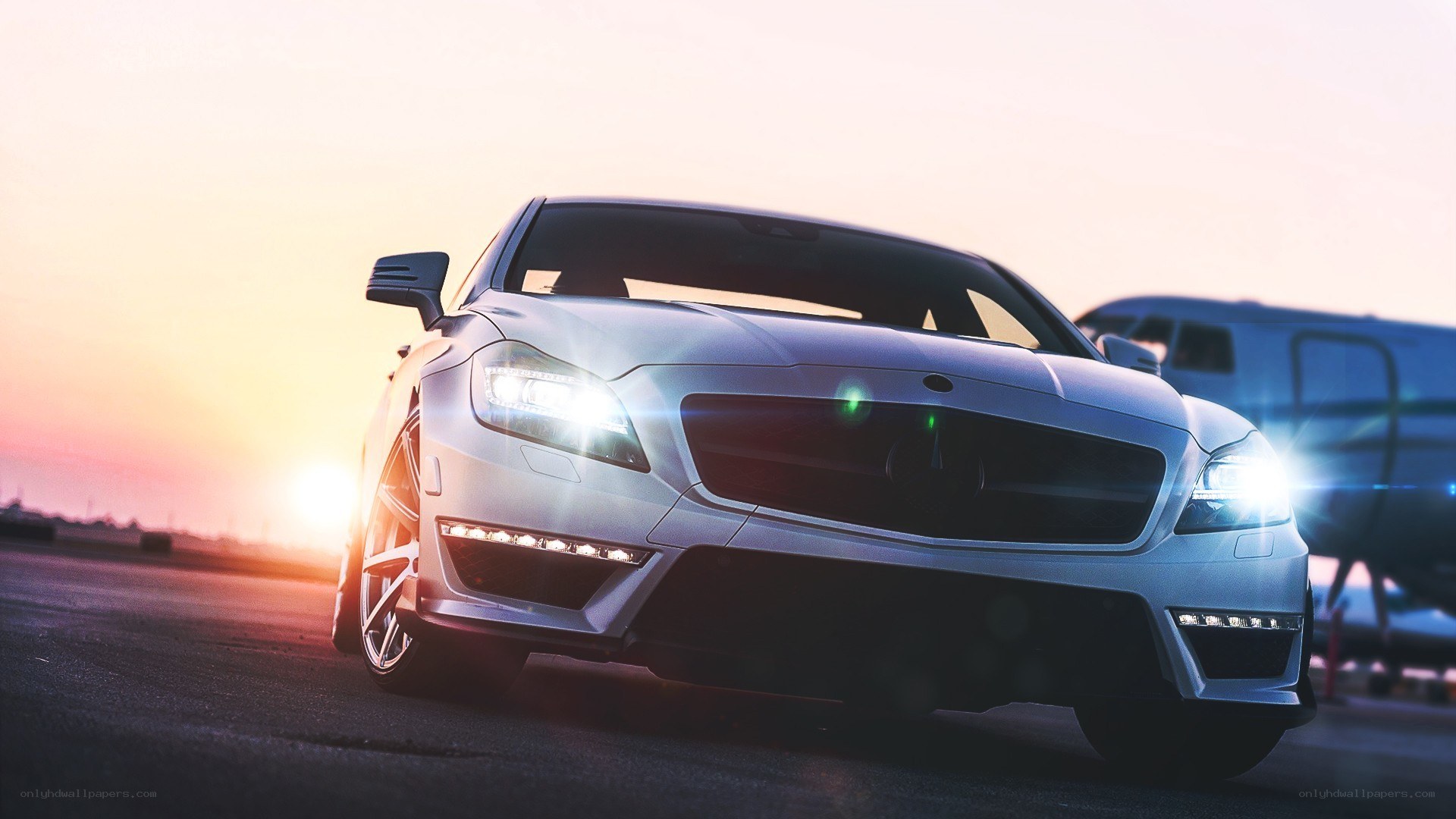 White sports car at sunset