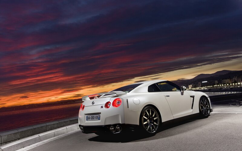 White sports car at sunset
