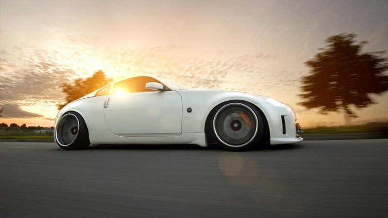 white sports car at sunset