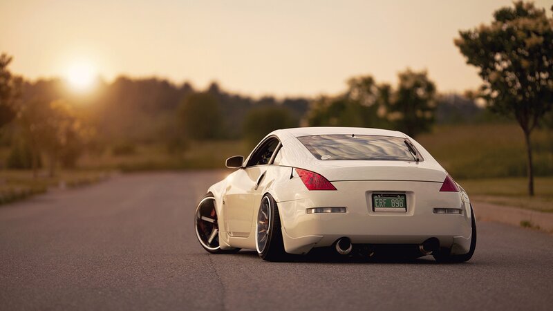 white sports car at sunset