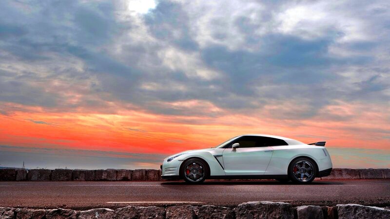 White sports car at sunset