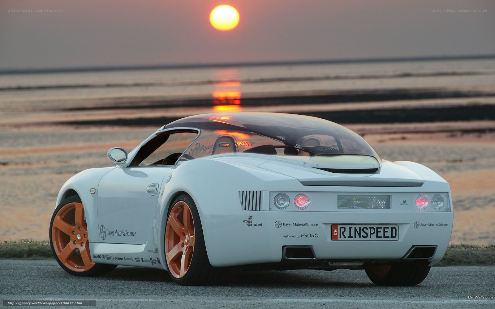 white sports car at sunset