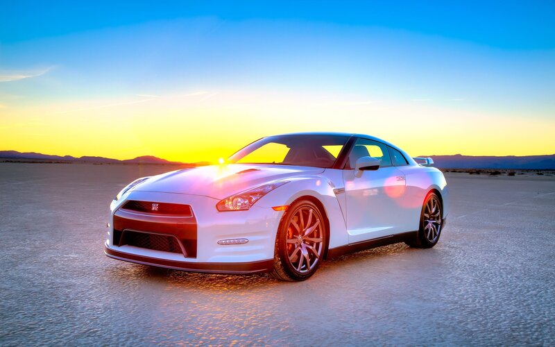 White sports car at sunset