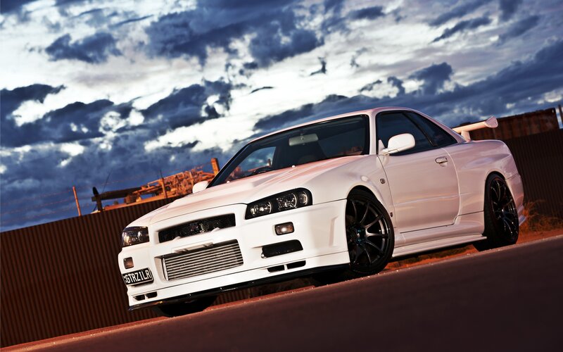 white sports car at sunset