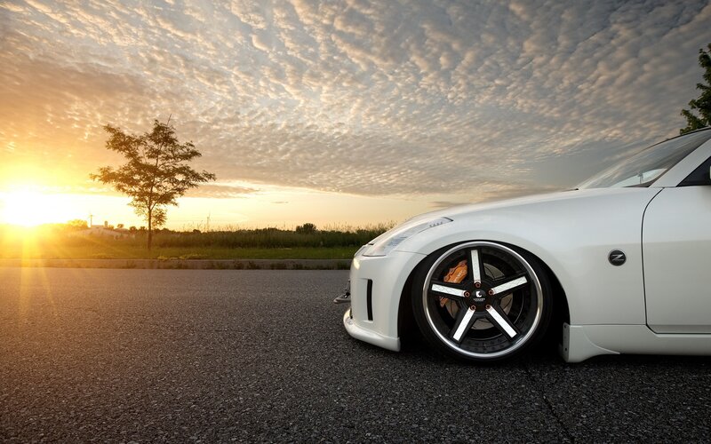 white sports car at sunset