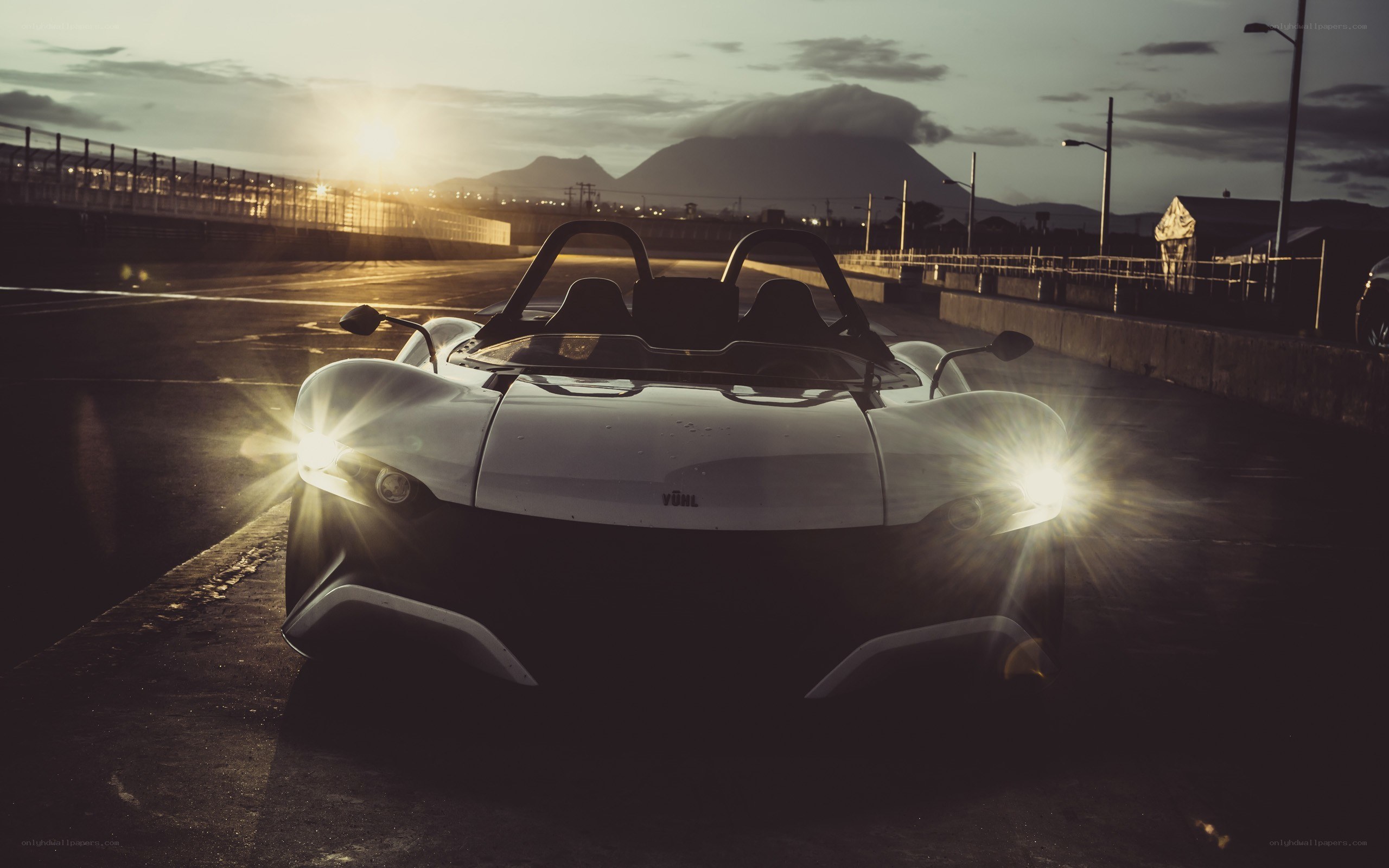 White sports car at sunset