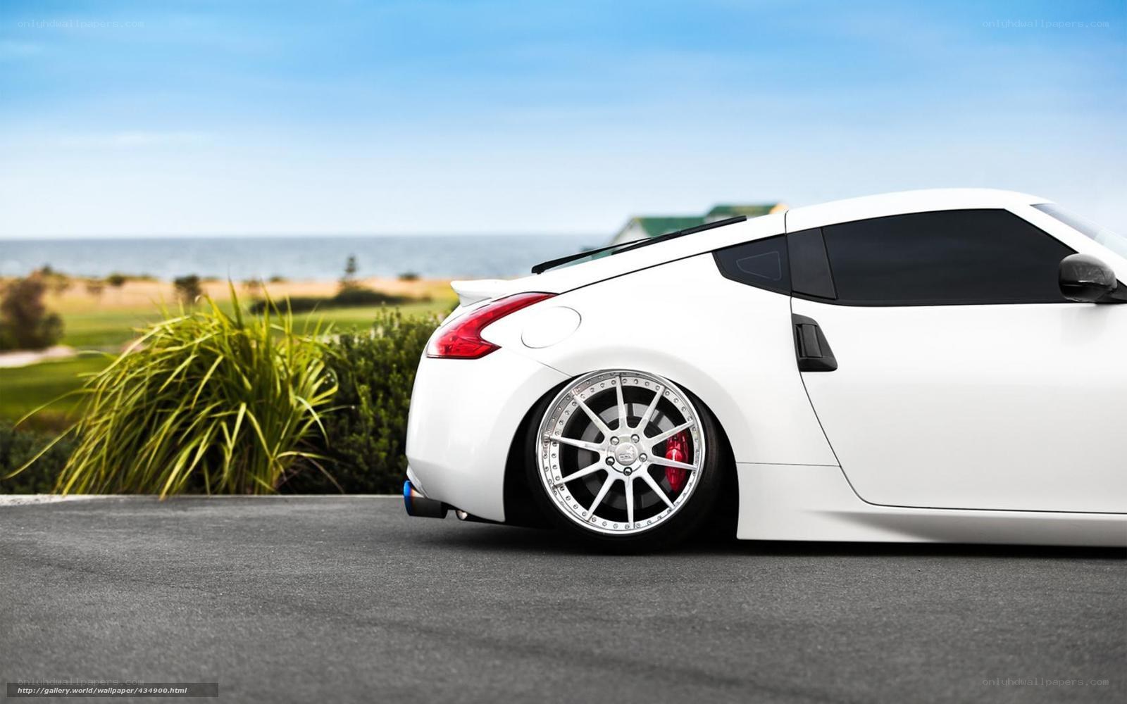 white sports car by the sea