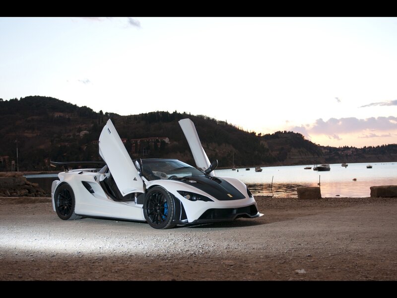 White sports car by the water