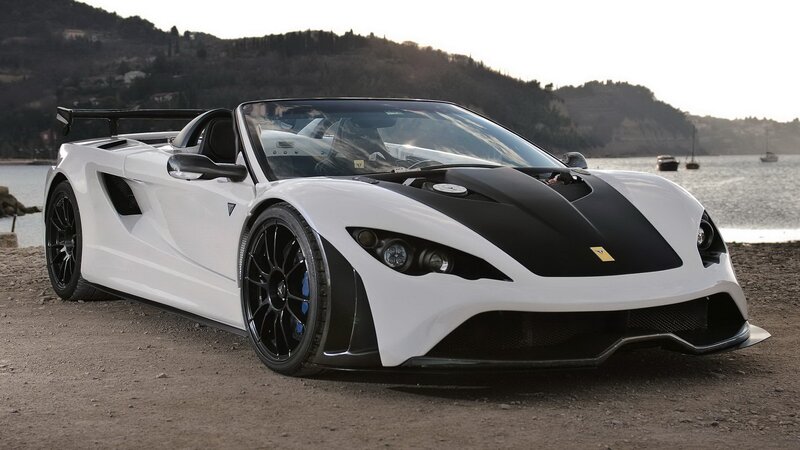 white sports car by the water