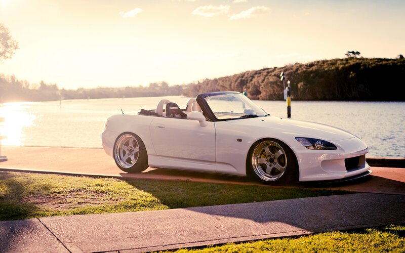 White sports car by the water