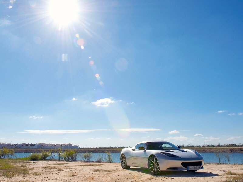 White sports car by the water
