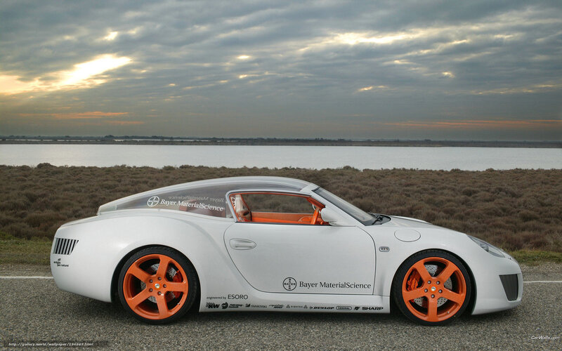 white sports car by water